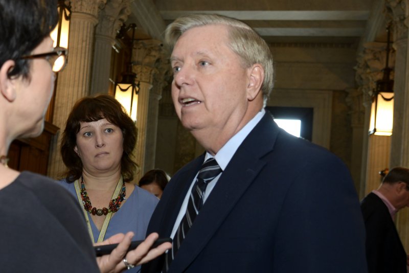 Sen. Lindsey Graham of South Carolina talks to reporters Thursday during a vote in the Senate on ending U.S. support for the Saudi-led war in Yemen.&nbsp; Photo by Mike Theiler/UPI