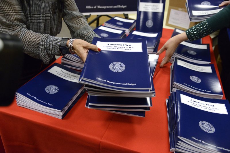 Government Printing Office staff distribute copies of the Fiscal Year 2018 Budget at the GPO bookstore on Thursday in Washington. The Trump administration's blueprint "skeleton" budget only covers discretionary spending and features a $54 billion increase in military spending and cuts for 18 other agencies. Photo by Mike Theiler/UPI