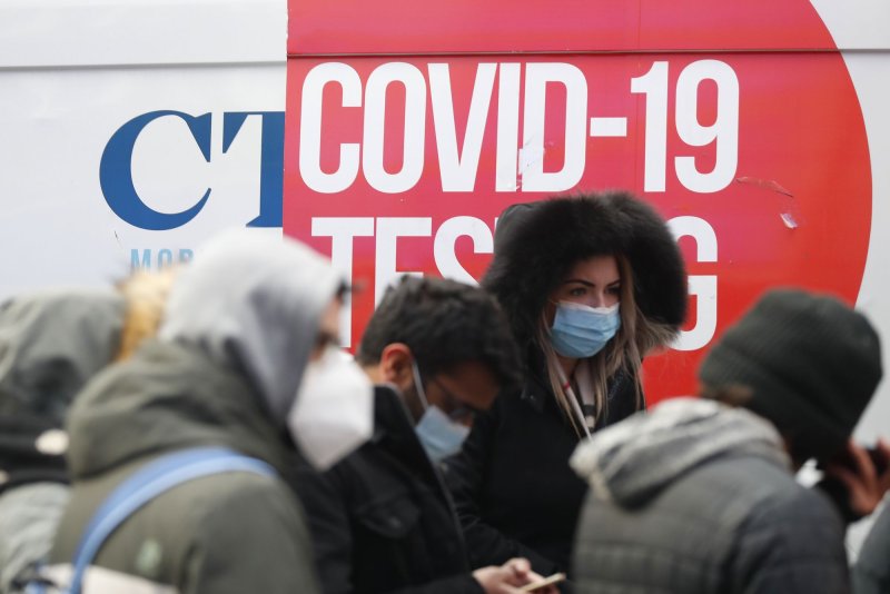 People wait in line to be tested for COVID-19&nbsp;in New York City's Times Square on Tuesday. Photo by John Angelillo/UPI