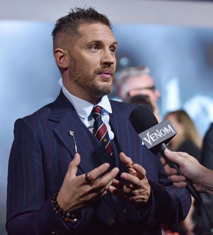 Tom Hardy speaks with television reporters as he attends the premiere of "Venom" at the Regency Village Theater in Los Angeles on October 1, 2018. The actor turns 46 on September 15. File Photo by Chris Chew/UPI