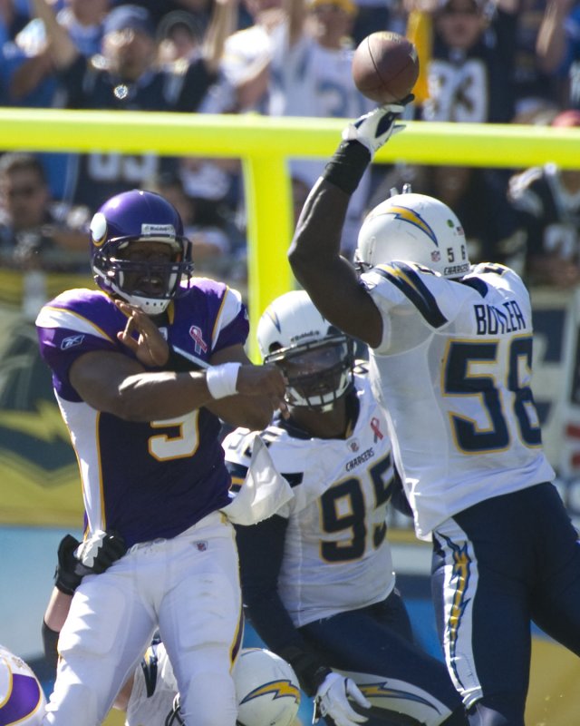 Quarterback Donovan McNabb (5), then with the Minnesota Vikings, has a pass knocked down by San Diego Chargers' Donald Butler (56) at Qualcomm Stadium in San Diego, Sept. 11, 2011. UPI/Jon SooHoo