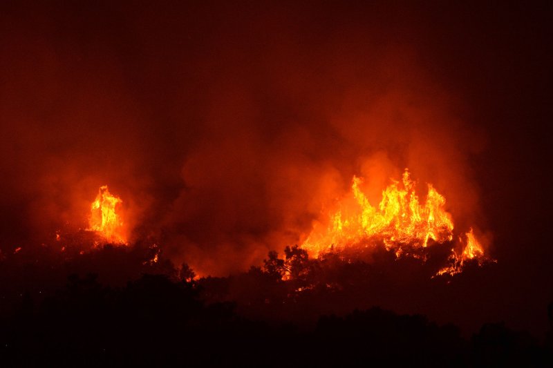 Flames from the Thomas Fire burn late Monday in Carpinteria, Calif. The blaze was 30 percent contained late Wednesday. Photo by Jim Ruymen/UPI | <a href="/News_Photos/lp/0f46b005f4873c5bca9208d73565ba8a/" target="_blank">License Photo</a>