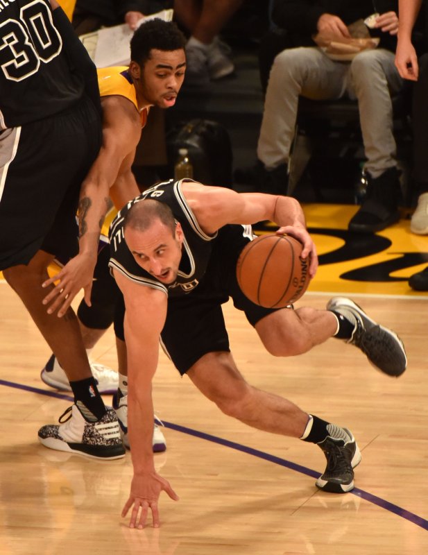 San Antonio Spurs guard Manu Ginobili drives past Lakers' Lou Williams during first quarter at Staples Center in Los Angeles on Jan. 22. Ginobili is expected to return to play this week after surgery for a serious testicular injury he suffered in a game Feb. 2. Photo by Jon SooHoo/UPI