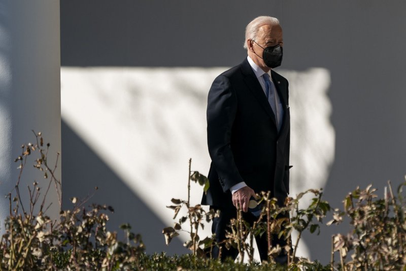 President Joe Biden walks across the South Lawn of the White House in Washington, D.C., on Friday. He spoke Sunday with&nbsp;Ukrainian President Volodymyr Zelensky&nbsp;regarding a possible invasion of Ukraine by Russia. Photo by Shawn Thew/UPI