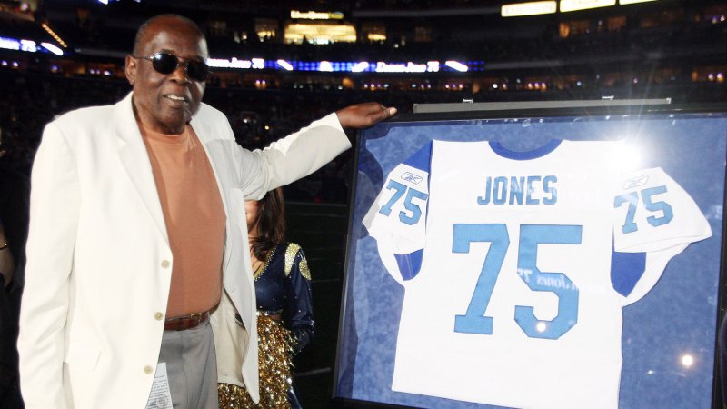 Hall of Fame defensive end David "Deacon"Jones who played for the Los Angeles Rams between 1961-1971 stands next to his number 75. File/UPI/Bill Greenblatt | <a href="/News_Photos/lp/ec42c485942c61c1c59bf7556c917007/" target="_blank">License Photo</a>