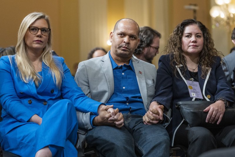 Sandra Garza (R) filed a wrongful death lawsuit against former President Donald Trump and two others this week over the death of her partner Capitol Police Office Brian Sicknick. File Photo by Pat Benic/UPI