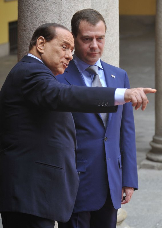 Italian Prime Minister Silvio Berlusconi (L) greets Russian President Dmitry Medvedev before their meeting at the Prefecture Palace in Milan July 23, 2010. UPI Photo/Alex Volgin..