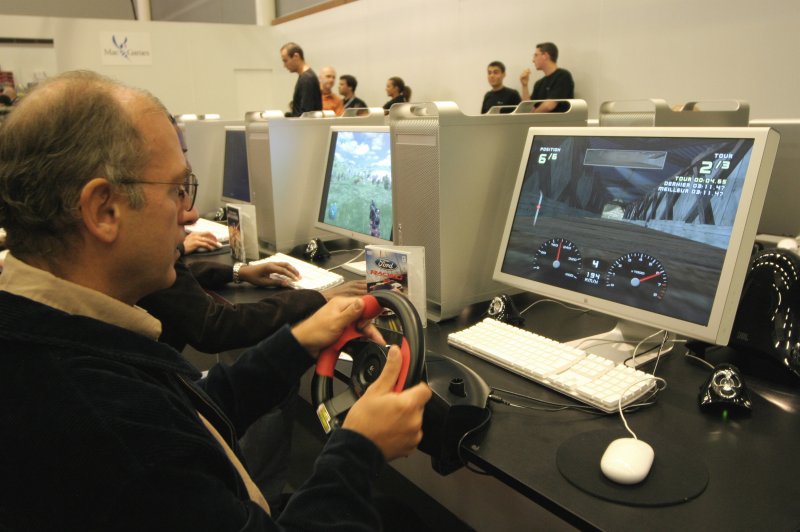 A man plays a driving video game. (File/UPI Photo/David Silpa)