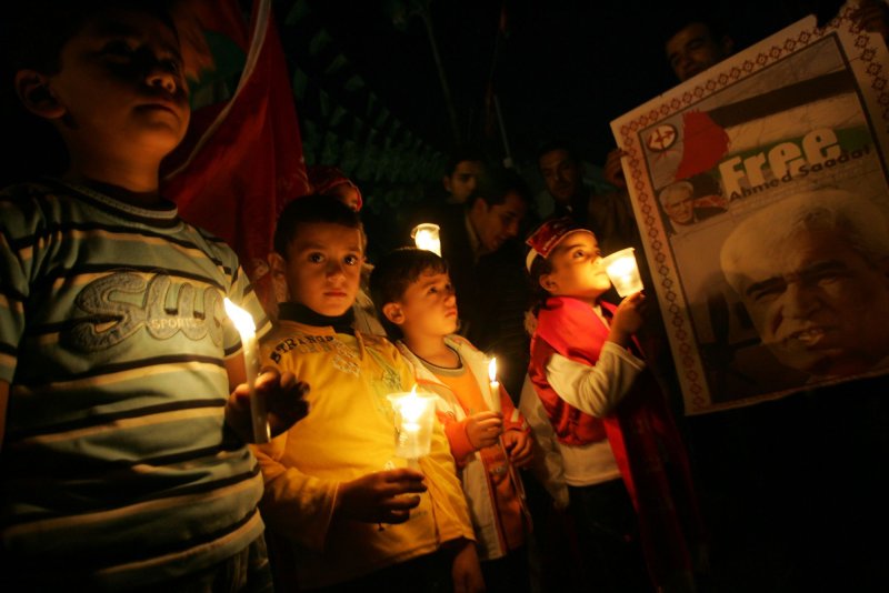 Palestinians take part in a candlelight vigil to mark Palestinian Prisoners Day in Rafah in the southern Gaza Strip on April 17, 2010. Hamas and Fatah closed ranks to mark Palestinian Prisoners Day in the first joint initiative by the bitter rivals since the latter was routed from Gaza in 2007. UPI/Ismael Mohamad