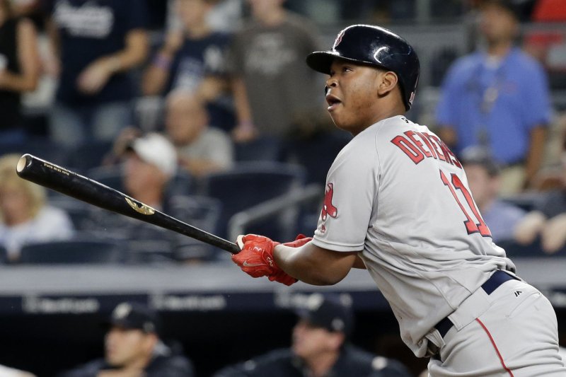 Boston Red Sox Rafael Devers hits a game tying home run in the 9th inning against the New York Yankees at Yankee Stadium in New York City on August 13, 2017. Photo by John Angelillo/UPI