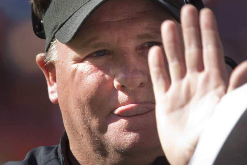 Philadelphia Eagles head coach Chip Kelly listens to a referee explain a call against the Denver Broncos during the third quarter at Sports Authority Field at Mile High in Denver on September 29, 2013. Denver is one of seven undefeated teams in the NFL. UPI/Gary C. Caskey