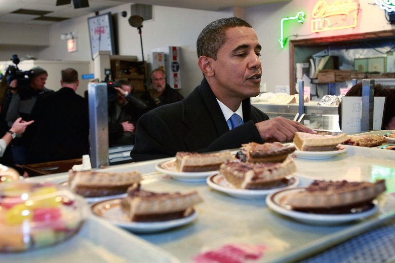 Then U.S. President-elect Barack Obama, in a file photo, checks out the pie offerings at Manny's Coffee Shop and Deli during a lunch break from his transition office at the federal building in Chicago, Illinois on November 21, 2008. Obama ordered a corned beef sandwich and greeted customers before leaving the restaurant. (UPI Photo/Scott Olson/POOL)