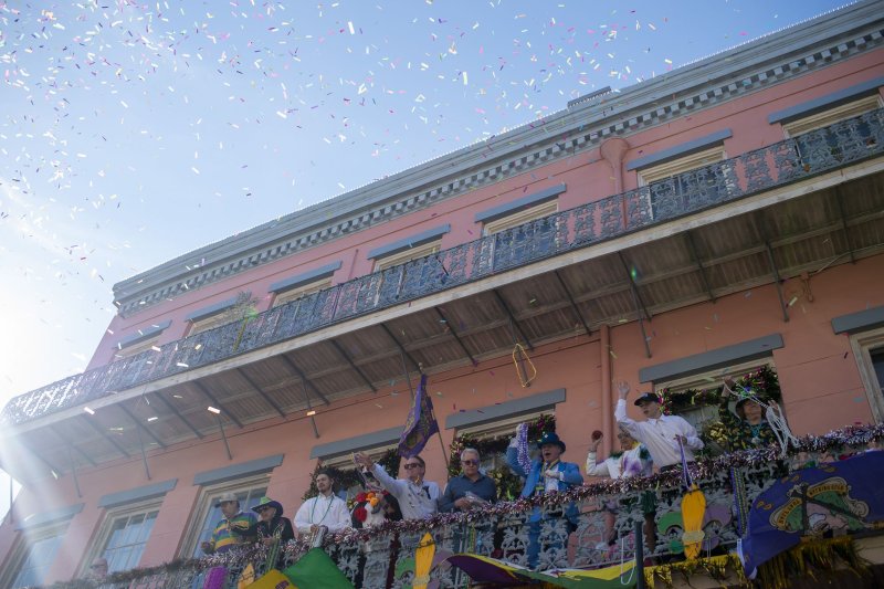 People on balconies throw beads to people celebrating Mardi Gras on Bourbon Street in New Orleans. The state's governor has been cheering recent developments in carbon capture and storage technology slated for the Gulf Coast. File photo by Bonnie Cash/UPI