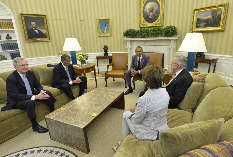 U.S. President Barack Obama (C) holds a meeting with Congressional leaders (L-R) Senate Minority Leader Mitch McConnell (R-KY), House Speaker John Boehner (R-OH), House Minority Leader Nancy Pelosi (D-CA) andSenate Majority Leader Harry Reid (D-NV) and) in the Oval Office at the White House, June 18, 2014, in Washington, DC. The meeting was for briefings on the deteriorating situation in Iraq, as the militants of the Islamic State of Iraq and Syria continue consuming Iraqi territory on the road to Baghdad. UPI/Mike Theiler