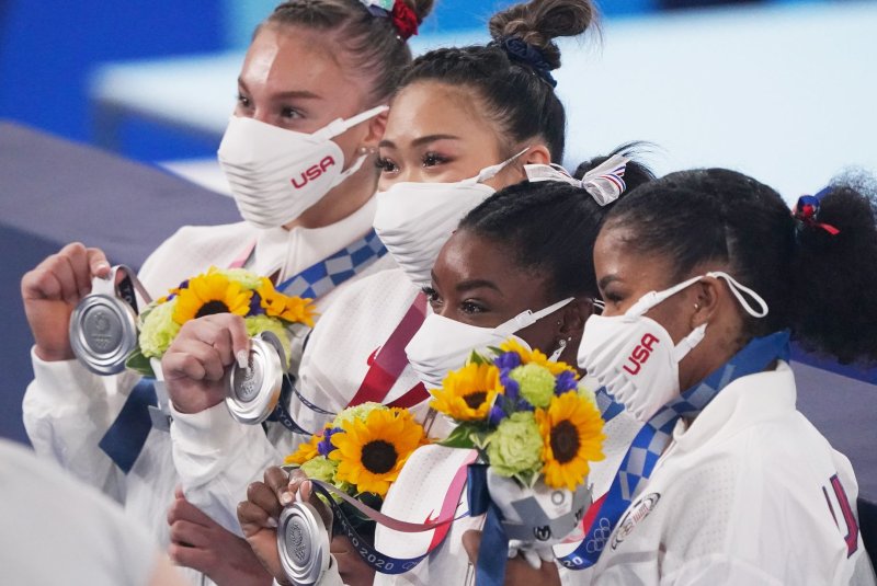 Team USA gymnasts Grace McCallum (L to R), Sunisa Lee, Simone Biles and Jordan Chiles hold their silver medals after the women's gymnastics team finals at the 2020 Summer Games on Tuesday in Tokyo. Photo by Richard Ellis/UPI | <a href="/News_Photos/lp/4c122e44fe414c31340a319c4cf65d52/" target="_blank">License Photo</a>