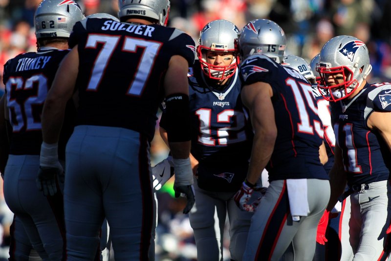 New England Patriots quarterback Tom Brady (12) calls a play in the huddle in the first quarter against the Los Angeles Rams at Gillette Stadium in Foxborough, Massachusetts, on December 4, 2016. The Patriots defeated the Rams 26-10 and Brady became the NFL's all-time leader for wins by a quarterback for a total of 201 wins in 264 games. Photo by Matthew Healey/UPI