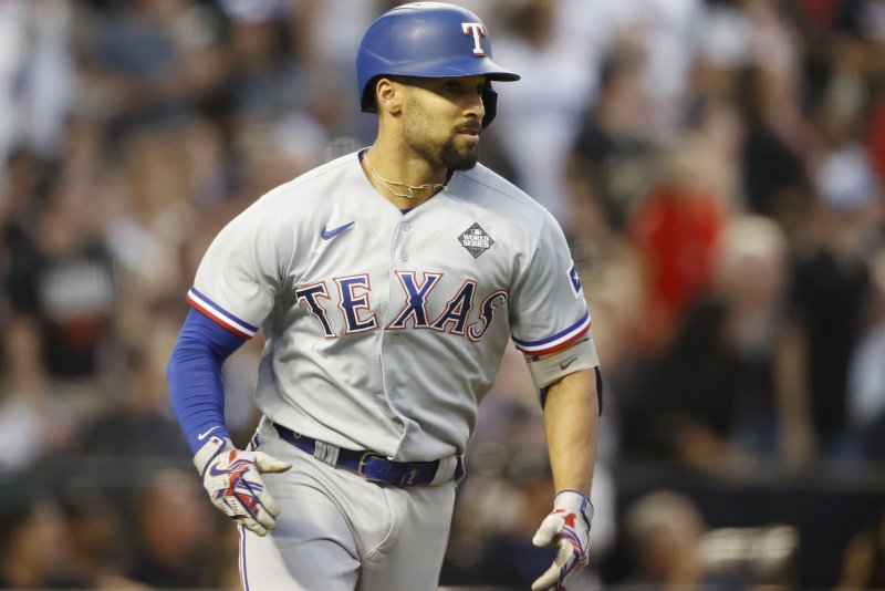 Texas Rangers second baseman Marcus Semien runs the bases after hitting a two-run triple in the second inning against the Arizona Diamondbacks in Game 4 of the 2023 World Series on Tuesday at Chase Field in Phoenix. Photo by John Angelillo/UPI