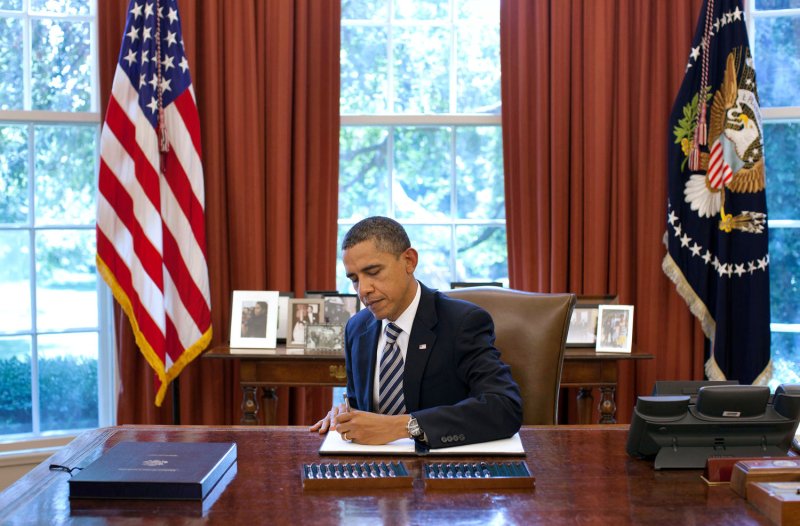 U.S. President Barack Obama signs the Budget Control Act of 2011 in the Oval Office of the White House on August 2, 2011. The Senate passed the House bill, which received approval the day before, which raised the debt ceiling and averted an unprecedented default on U.S. issued debt. UPI/Pete Souza/Official White House Photo | <a href="/News_Photos/lp/f0cd097432d7e3404f8d84ed058bf70e/" target="_blank">License Photo</a>