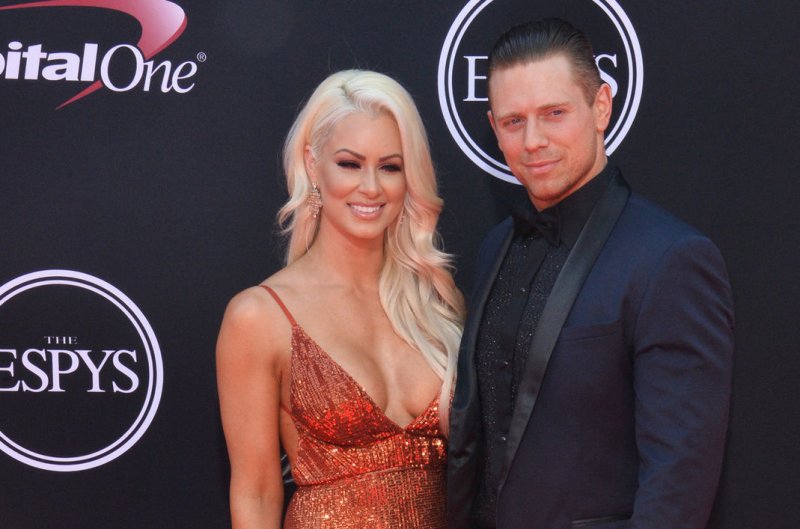 Michael Mizanin (R), aka The Miz, and Maryse Ouellet, aka Maryse, attend the ESPY Awards on July 12. The couple announced on Monday's episode of "WWE Raw" that Maryse is pregnant with their first child. File Photo by Jim Ruymen/UPI