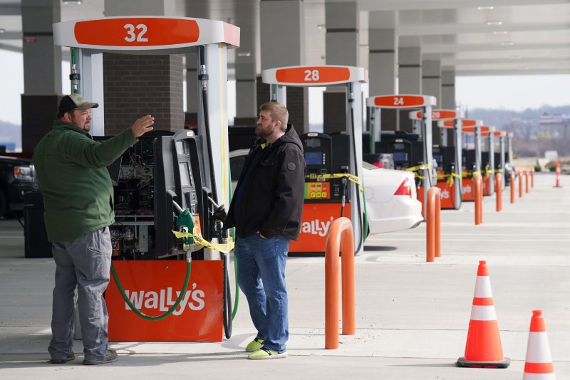 Workers prepare the gas pumps for the grand opening at Wally's in Fenton, Mo., on March 10. File Photo by Bill Greenblatt/UPI | <a href="/News_Photos/lp/41a5fb2fae4dc16054992c4231800684/" target="_blank">License Photo</a>