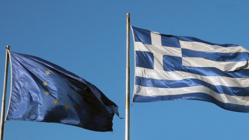 The Euro and Greek flags. UPI/Hugo Philpott