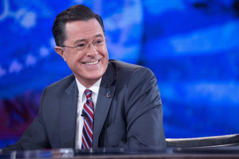 Stephen Colbert smiles while taping the 'The Colbert Report' with President Barack Obama in the Lisner Auditorium at George Washington University in Washington, D.C., U.S., File photo by Andrew Harrer/Pool/UPI