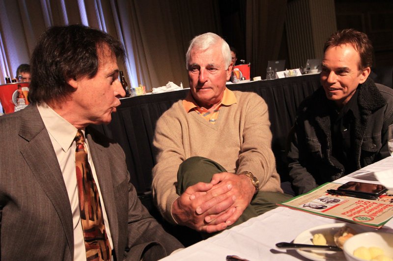 Former college basketball coach Bob Knight (C) was hospitalized Friday because of an illness, but was released Monday, his family said. File Photo by Bill Greenblatt/UPI