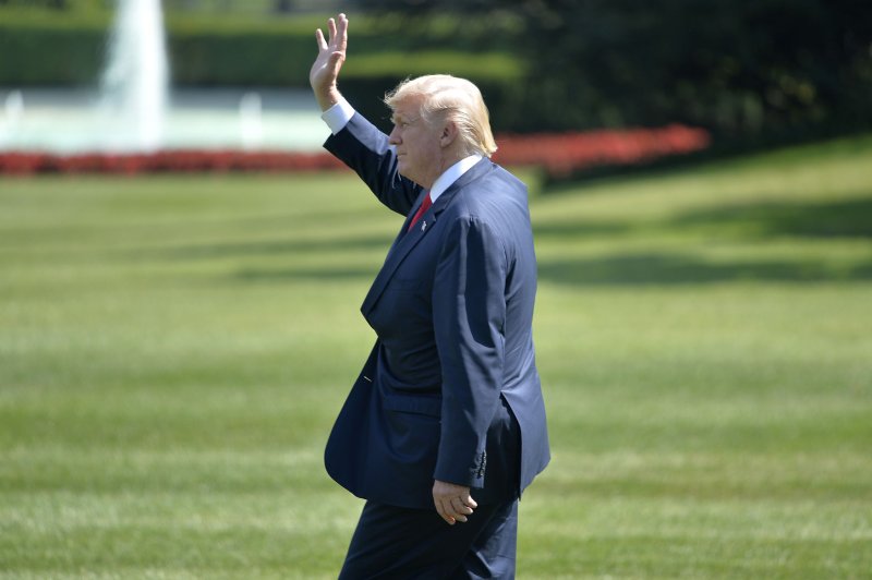 President Donald Trump waves to guests and the press as he departs the White House, on his way to his New Jersey country club for vacation. While he's gone, the White House will undergo a $3.4 million renovation. Photo by Mike Theiler/UPI