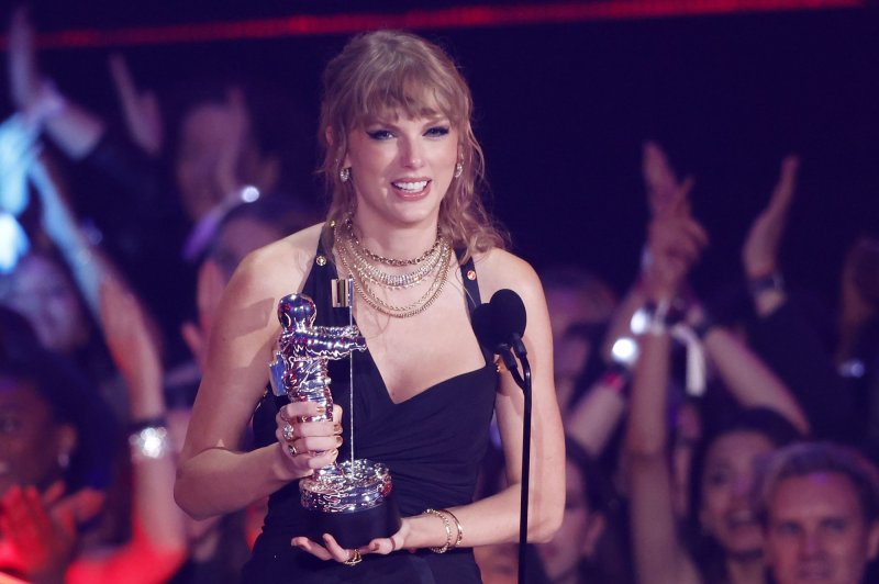 Taylor Swift cheered on rumored boyfriend Travis Kelce at the Kansas City Chiefs football game Sunday with Blake Lively, Ryan Reynolds and other celebrities. File Photo by John Angelillo/UPI
