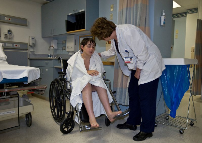 650,000 nurses, orderlies, aides and others injured yearly on the job. (UPI Photo/Gary C. Caskey)