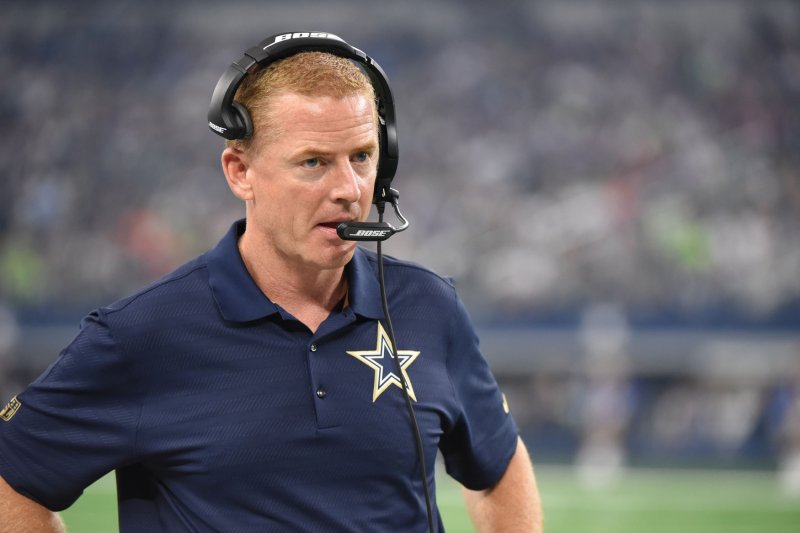 Dallas Cowboys head coach Jason Garrett talks to his staff as his team faces the Seattle Seahawks during the first half at AT&T Stadium. File photo by Ian Halperin/UPI
