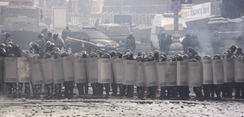 Ukrainian riot police stand near a barricade operated by anti-government protesters at the site of clashes with riot police in Kiev on January 25, 2014. Ukrainian President Viktor Yanukovich promises changes after violent clashes. UPI/Ivan Vakolenko | <a href="/News_Photos/lp/fffa10ccc4868bda526589e83020e324/" target="_blank">License Photo</a>