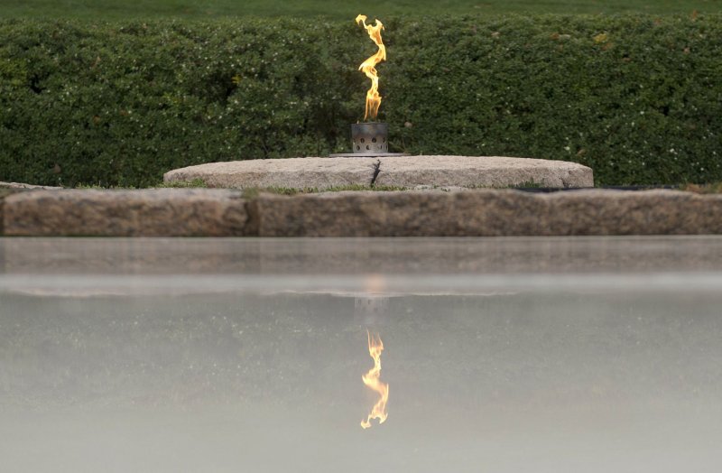 Eternal flame transferred back to permanent place on Kennedy's grave