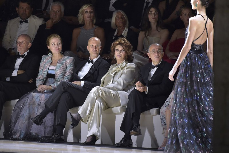 Left to right, Sasha Alexander, Edoardo Ponti, Sophia Loren and Giuseppe Tornatore attend the Giorgio Armani "One Night In Venice" runway show on September 2. Loren is recuperating after breaking her hip and femur in a weekend fall in her bathroom. Photo by Rocco Spaziani/UPI