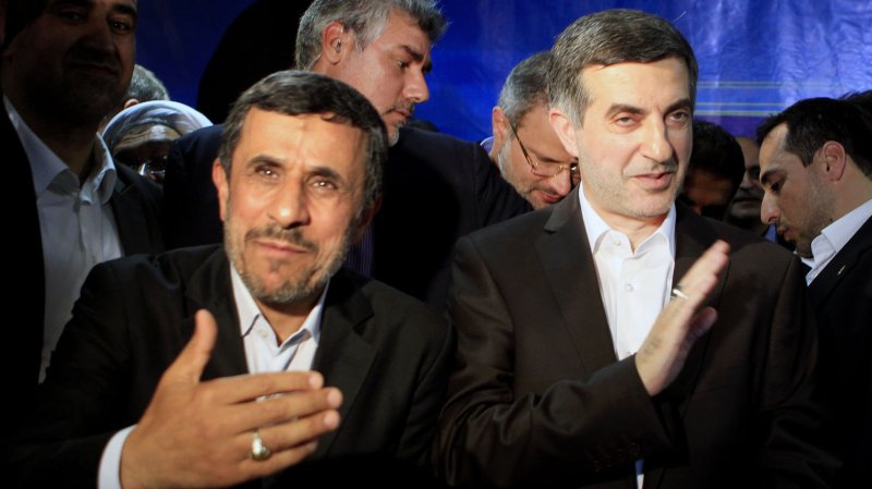The head of the Secretariat of the Non-Aligned Movement (NAM) and hopeful presidential candidate, Esfandiyar Rahim-Mashaei (R) waves to the media as he stands next to the Iranian president Mahmoud Ahmadinejad after he registered his candidacy for Iran's upcoming presidential election on May 11, 2013 in Tehran, Iran. Iran's presidential candidates must be vetted for qualifications by the Guardian Council, the country's top electoral supervisory body. UPI/Maryam Rahmanian