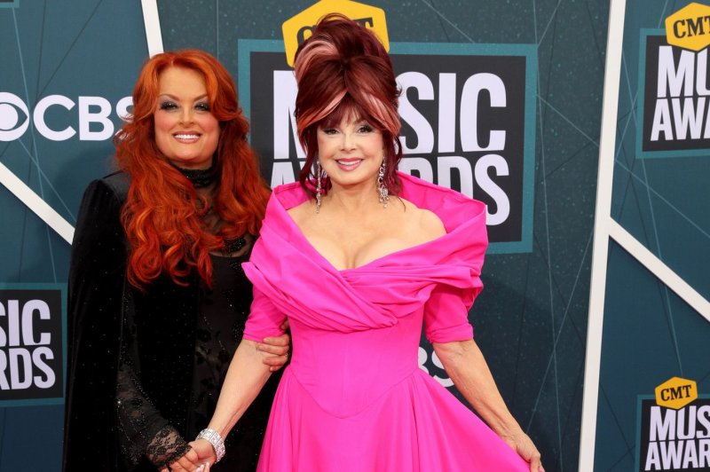Wynonna Judd (L), and her mother, Naomi Judd, arrive at the CMT Music Awards on April 11. Wyonna Judd has released a new song with Katie Crutchfield of Waxahatchee. File Photo by John Sommers II/UPI