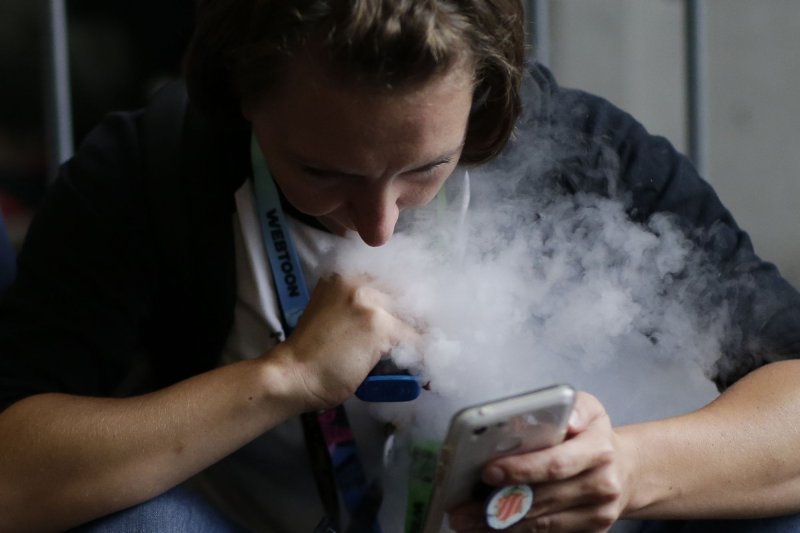 Among the British teen smokers, 57% said they also vaped, as did 58% of U.S. smokers. By their late teens, those who had both vaped and smoked in their early teens were more likely to continue smoking, the investigators found. File photo by John Angelillo/UPI