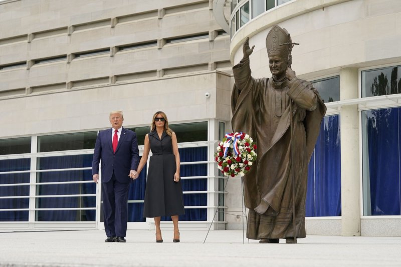 President Donald Trump and the first lady, Melania Trump, visit Saint John Paul II National Shrine in Washington, D.C., on Tuesday. Photo by Chris Kleponis/UPI