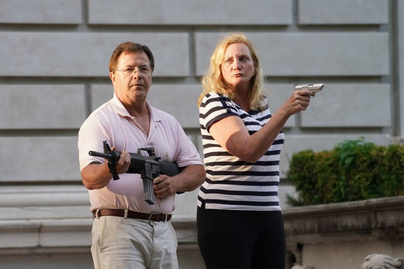St. Louis couple point guns at protesters