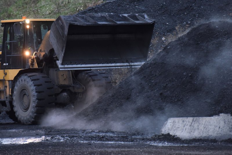 A CAT endloader moves coal at the Gateway Eagle Mine, an United Mine Workers mine in Pond Fork, Boone County, in southern West Virginia, in March 2016. Sixteen people were killed Sunday after being trapped in a burning coal mine in southern China. File Photo by Debbie Hill/ UPI