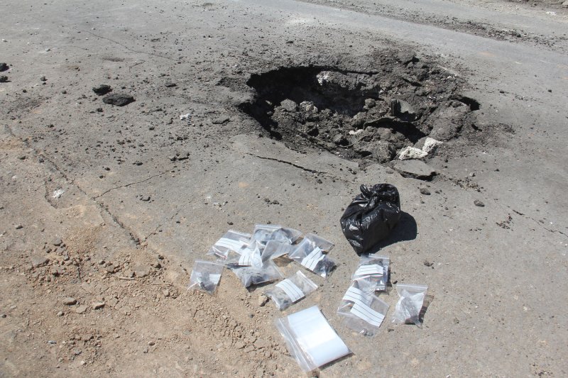 A crater is seen at the site of an airstrike on April 5 after what was described as a sarin gas attack in the town of Khan Sheikhoun, Syria, was purportedly launched by government forces. Photo by Omar Haj Kadour/UPI