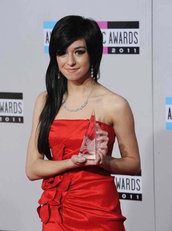 Singer Christina Grimmie arrives at the 39th American Music Awards at Nokia Theatre in 2011.She was shot and killed Friday following a concert appearance in Orlando. UPI/Jim Ruymen