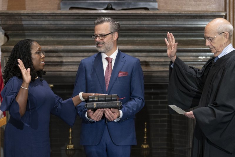Supreme Court Justice Stephen Breyer (R) administers the Judicial Oath to incoming Justice Ketanji Brown Jackson as her husband, Patrick Jackson, holds the Bible on June 30. File Photo courtesy of U.S. Supreme Court | <a href="/News_Photos/lp/d1fda0d014623f0f2152fa539302b788/" target="_blank">License Photo</a>