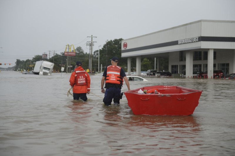 Members of the U.S. Coast Guard head into the water with their flat-bottom boats to assist locals during the flooding in Baton Rouge, La., on August 14, 2016. Authorities will attempt to relieve a housing crunch in Louisiana with mobile homes but officials said the temporary housing units are much better than the notorious FEMA trailers used after Hurricane Katrina. Photo by Brandon Giles/U.S. Coast Guard/UPI