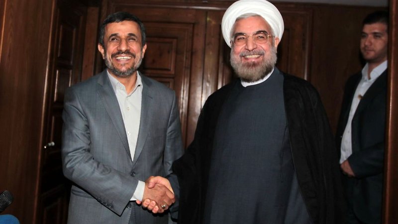 In this official handout image, Iran's outgoing president Mahmoud Ahmadinejad meets newly-elected president Hassan Rouhani in Tehran, Iran on June 18, 2013. UPI