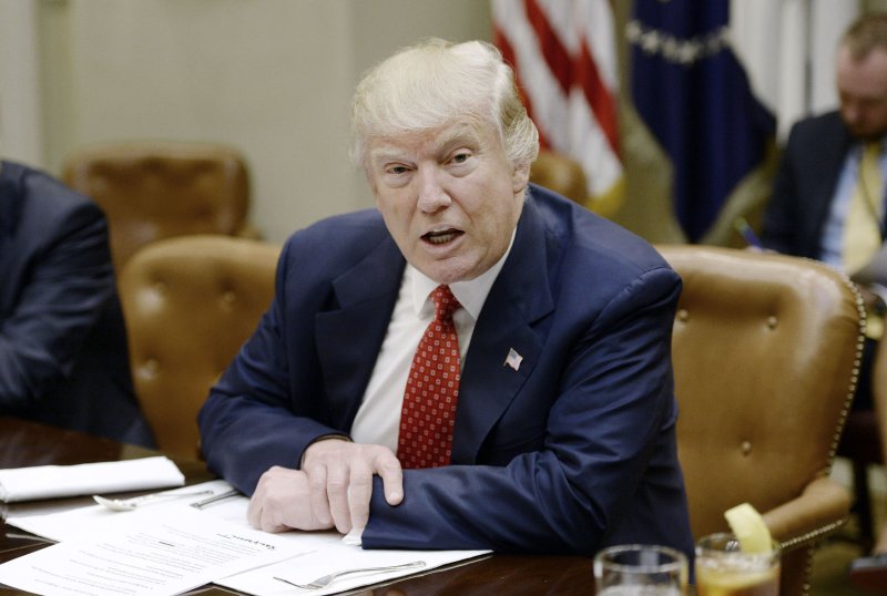 President Donald Trump, seen here discussing the Federal Budget in the White House on Wednesday, saw his approval ratings dip by 4 percent to 38 percent for the month of February, a Quinnipiac University poll shows. Pool Photo by Olivier Douliery/UPI