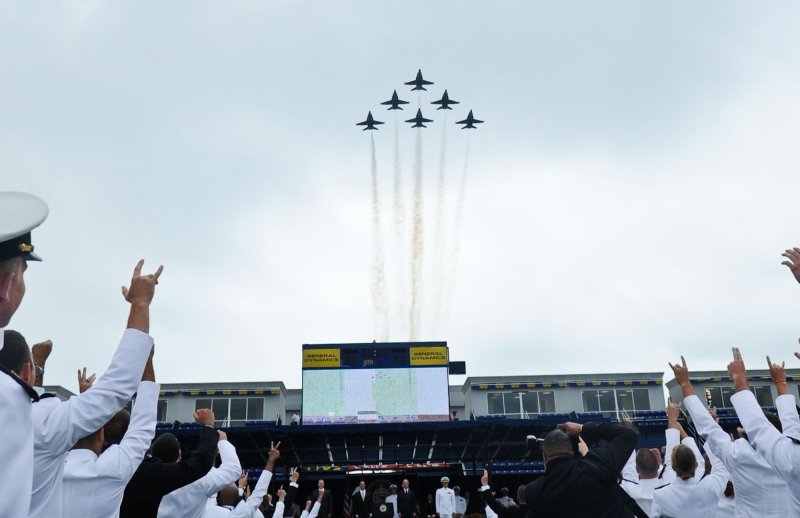 Midshipmen cheer as the Navy Blue Angels fly over during U.S. Naval Academy Graduation and Commissioning ceremonies in Annapolis, Md., May 28, 2010. UPI/Alexis C. Glenn