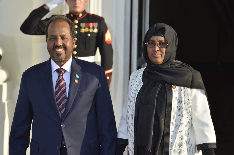 Somalia's President Hassan Sheikh Mohamud and his spouse Qamar Ali Omar greet the press as they arrive at the White House for a State Dinner on behalf of the US-Africa Leaders Summit, August 5, 2014, in Washington, DC. (UPI/Mike Theiler)