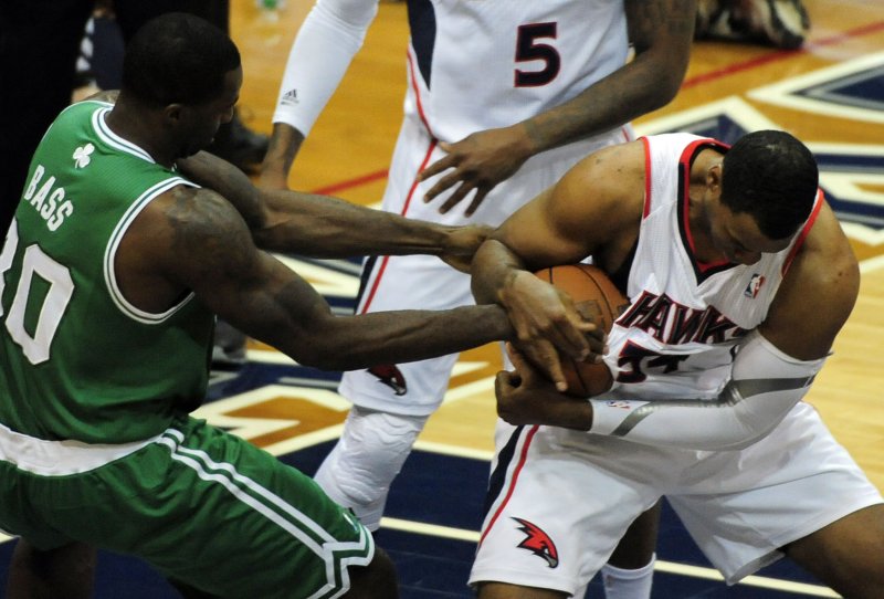 Atlanta Hawks center Jason Collins (34) wrestles with Boston Celtics forward Brandon Bass (30) for control in the first half of game 2 of the first round of the Eastern Conference Playoffs at Philips Arena in Atlanta on May 1, 2012. UPI/David Tulis | <a href="/News_Photos/lp/ef6a473f9a2df4d999108bc34c8e3ac1/" target="_blank">License Photo</a>