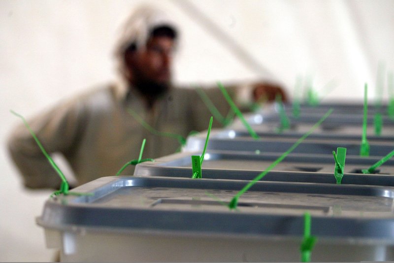 A worker stands next to ballot boxes from the Afghan presidential election at the Independent Election commission of Afghanistan (IEC) base in Kabul, Afghanistan on August 22, 2009. UPI/Mohammad Kheirkhah